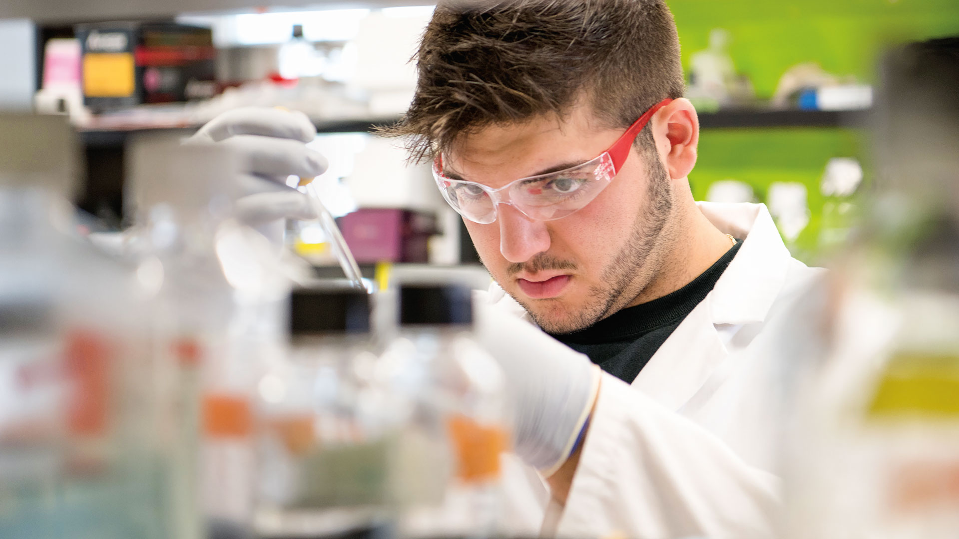 Student concentrating in the lab
